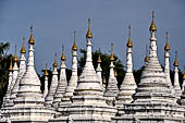 Myanmar - Mandalay, Sandamuni Pagoda. The entire ground is covered with 1749 small white pagodas with stone slabs with the Buddhist Tripitaka. 